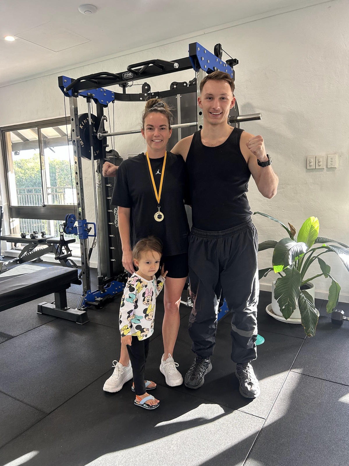 POLARIZE community challenge winner with coach and family